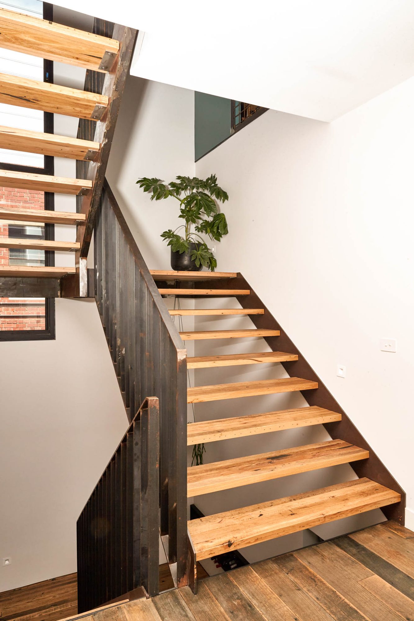 Timber stair core inside a completed North Melbourne townhouse